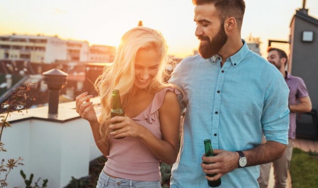 a man and woman drinking